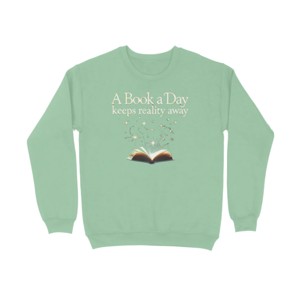 A Book A Day Unisex Sweatshirt in mint green featuring quote “A Book A Day Keeps Reality Away,” cozy soft book lover sweatshirt for readers by Store Asmi